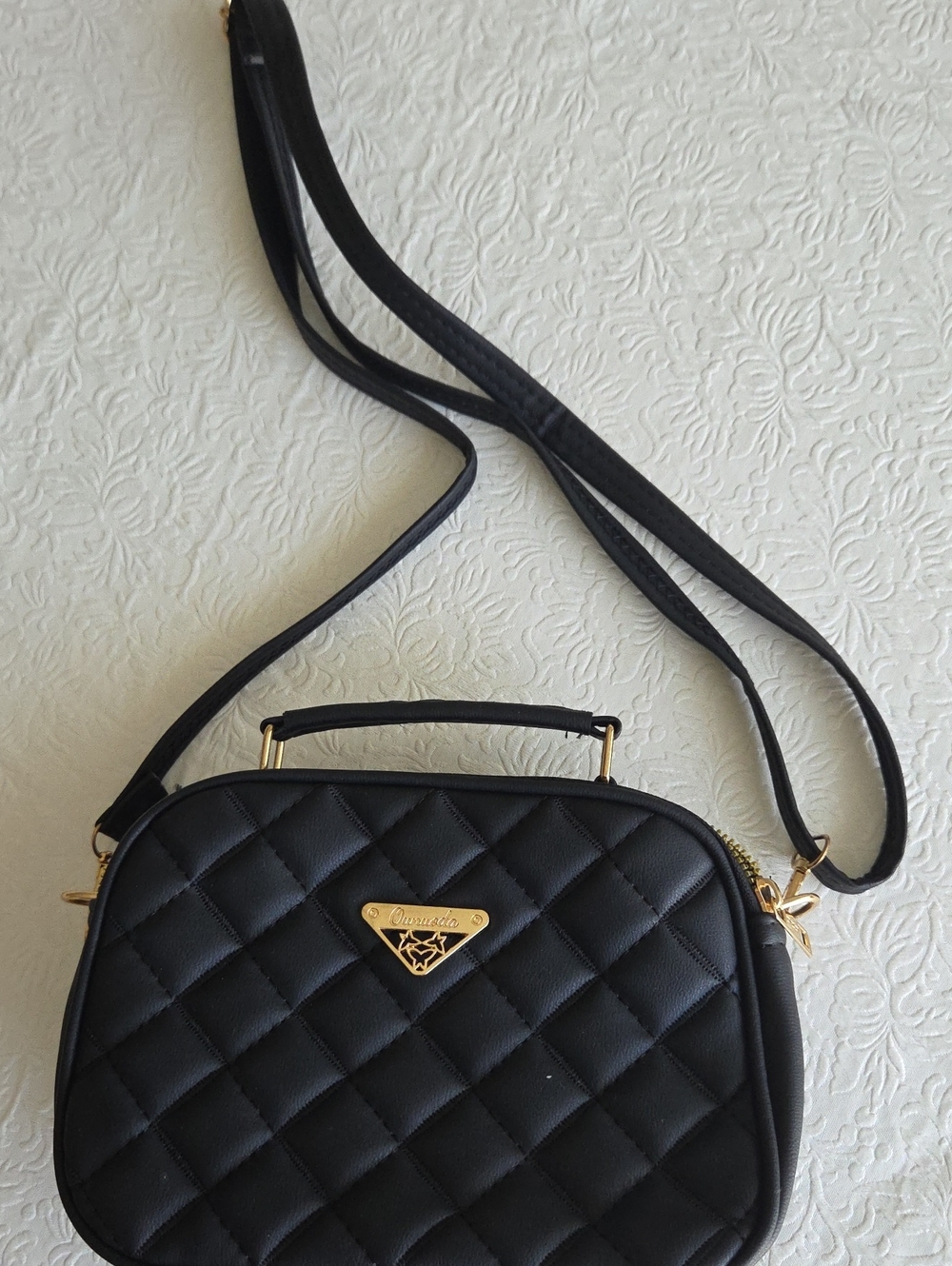 Black Quilted Crossbody Bag with Gold Accent Plate